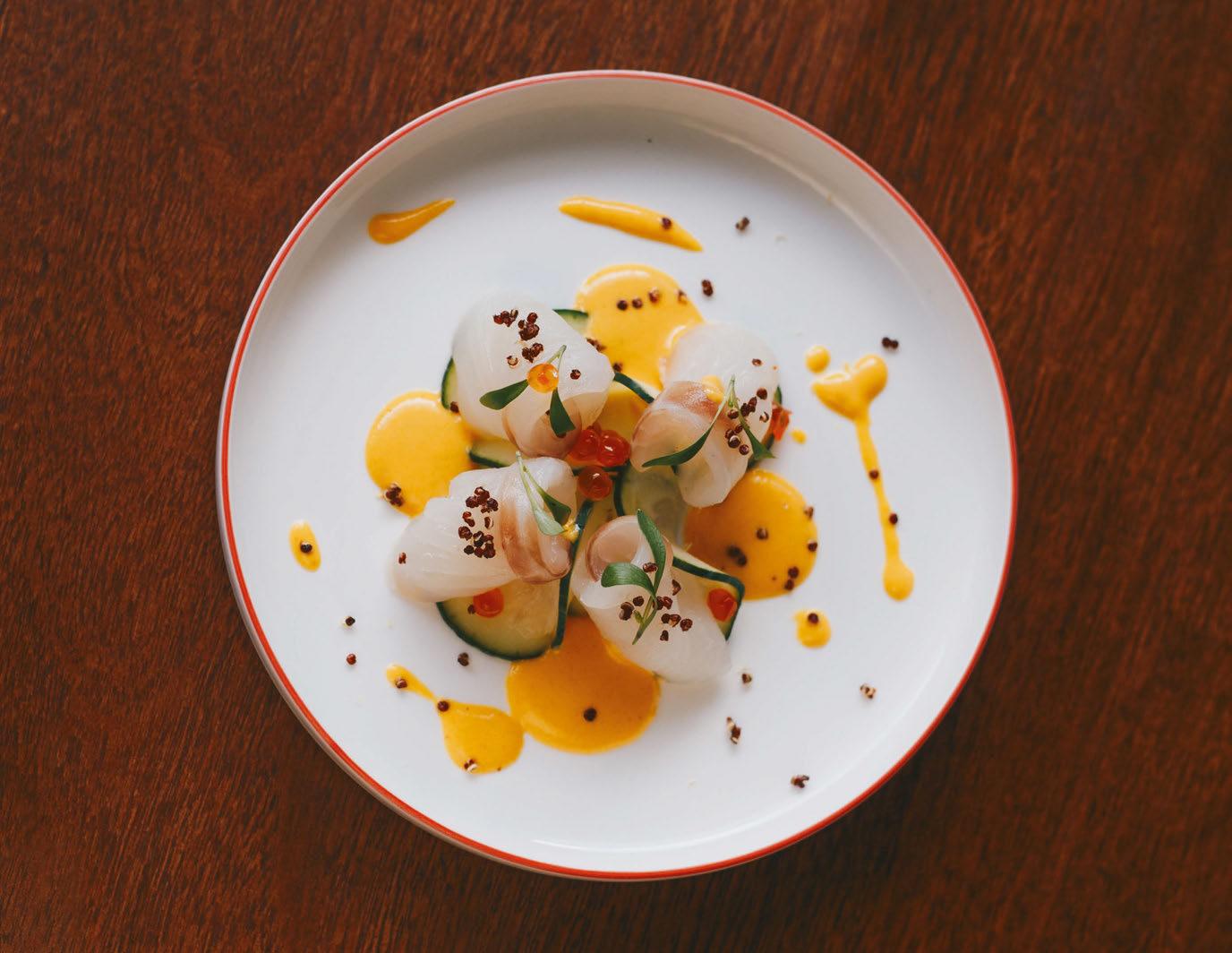 A calm, dimly lit table with a small bowl of walnuts and a glass of water, representing a quiet evening preparation